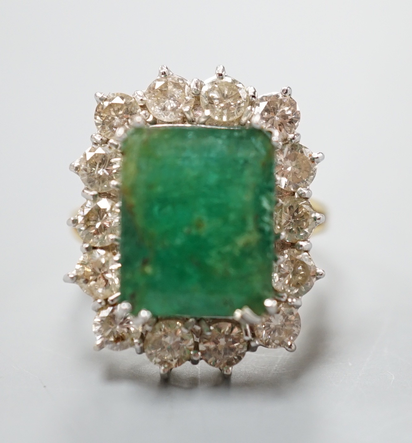 A yellow metal, emerald and diamond set rectangular cluster ring (shank cut), size M, gross weight 7.9 grams